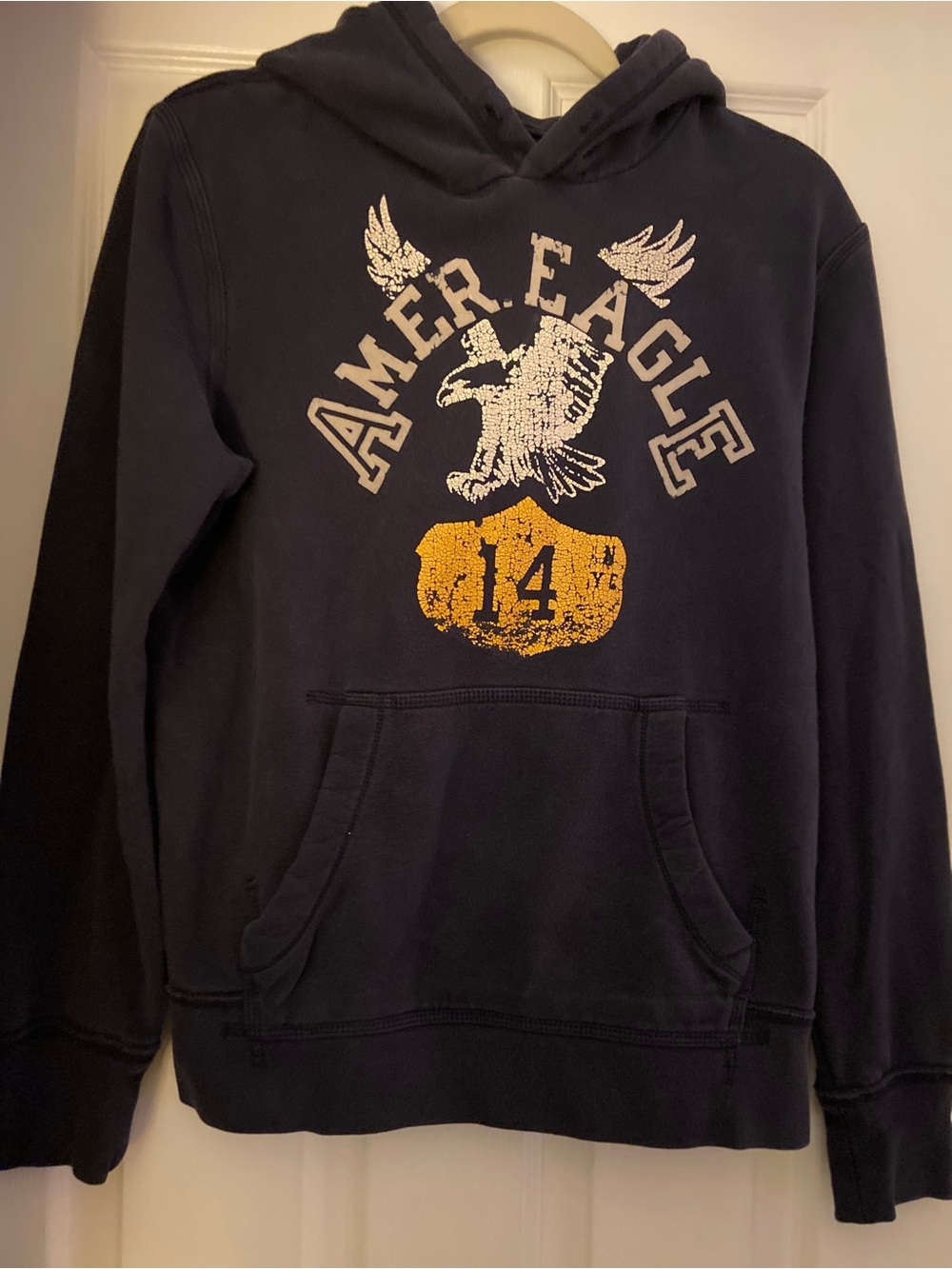 American Eagle Outfitters Navy Hoodie with Yellow Shield Graphic
